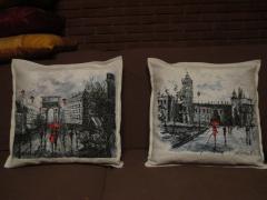 Embroidered cushions with city views designs