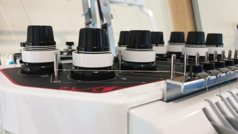 Embroidery thread tension according