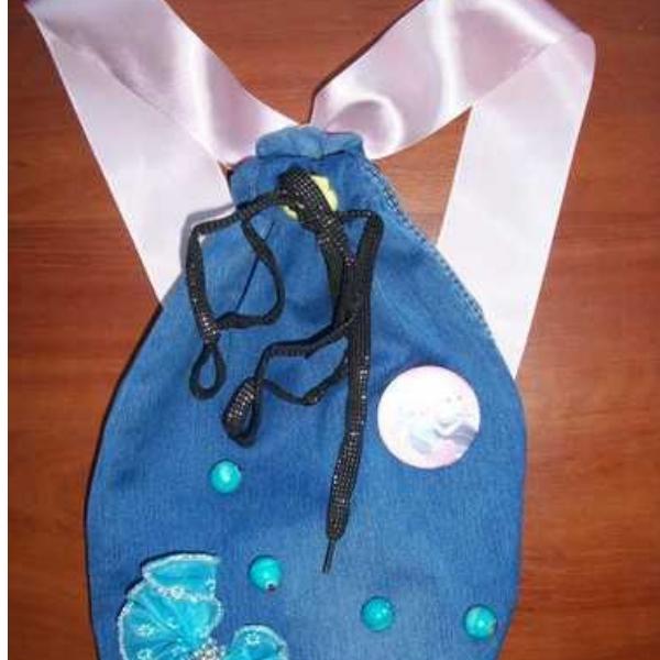A denim shoe bag with ribbons and drawstrings