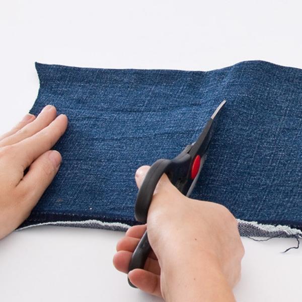 Piece of denim and scissors