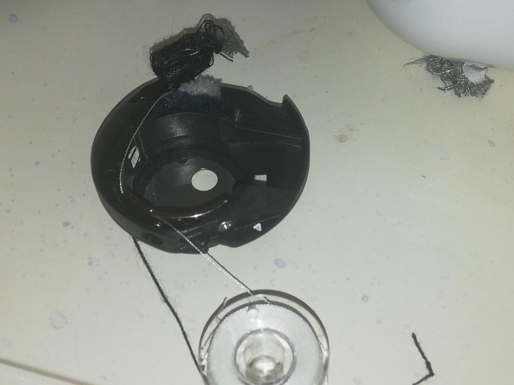 Upper thread under the footplate cover