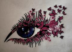Pink sparkle eye embroidered design