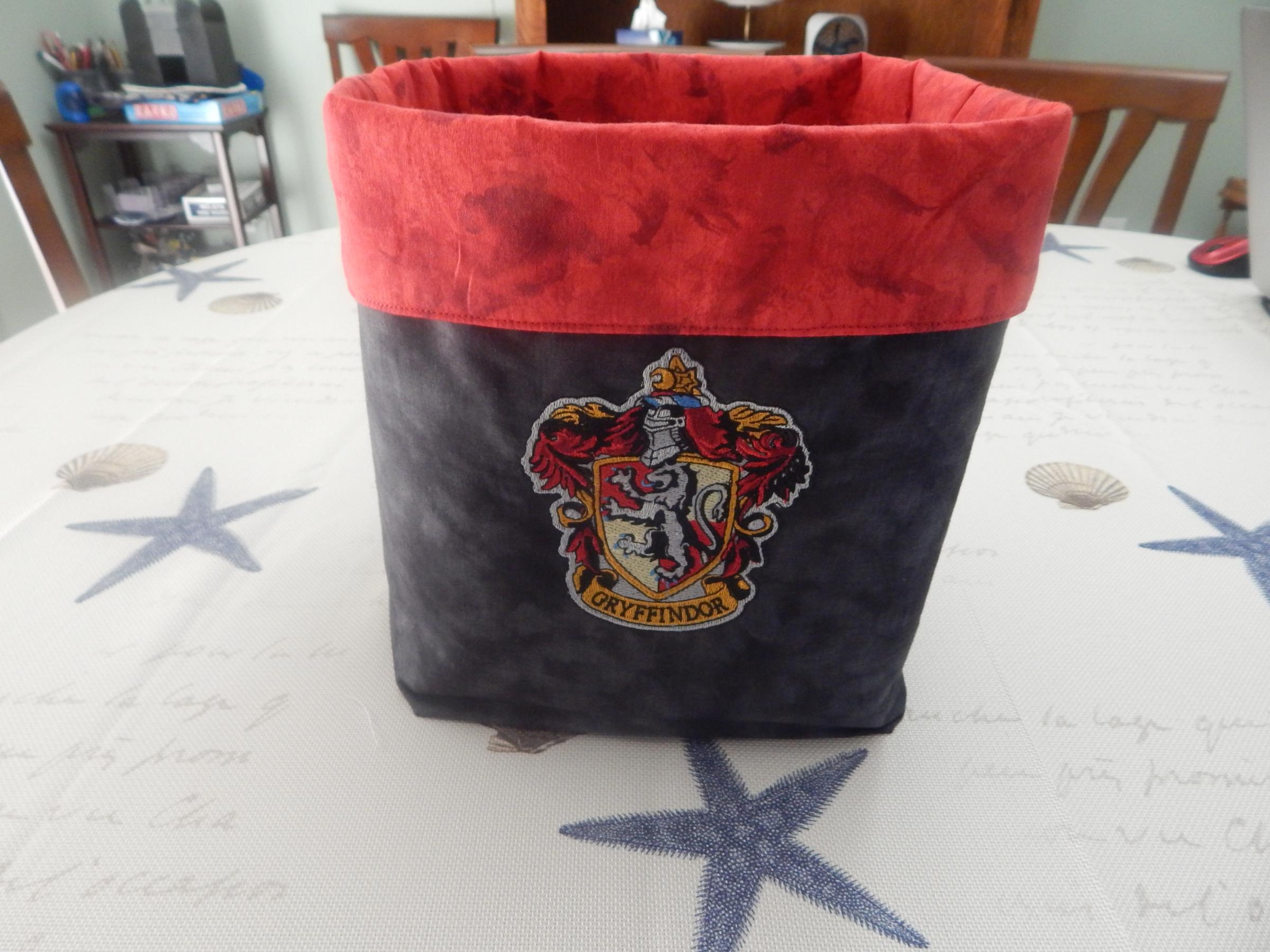 Embroidered textile box with Griffindor logo