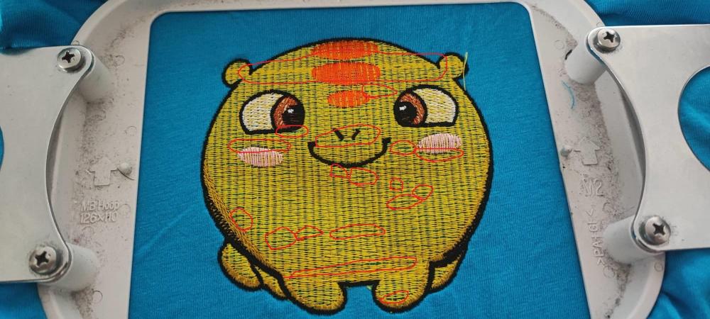 Embroidered design in hoop