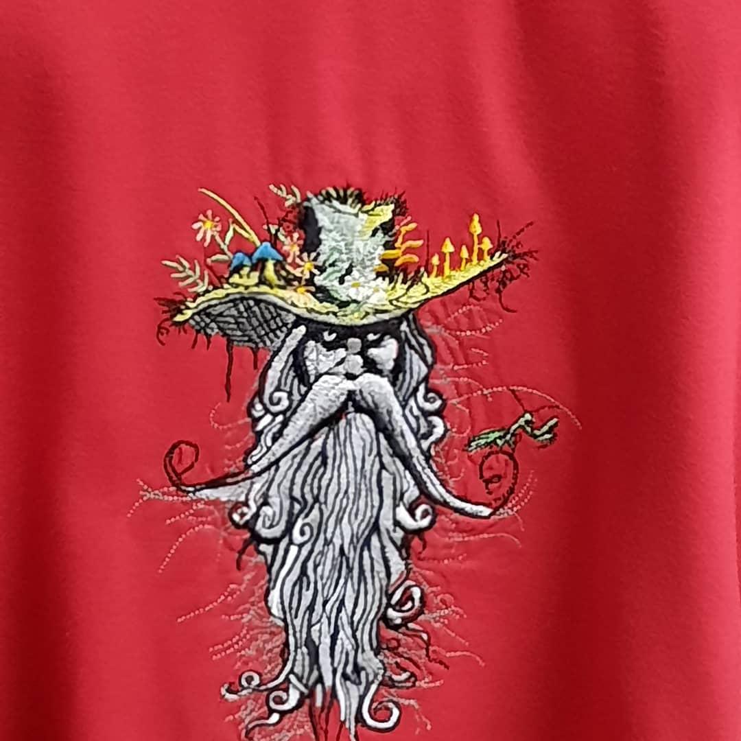 Embroidered root man design