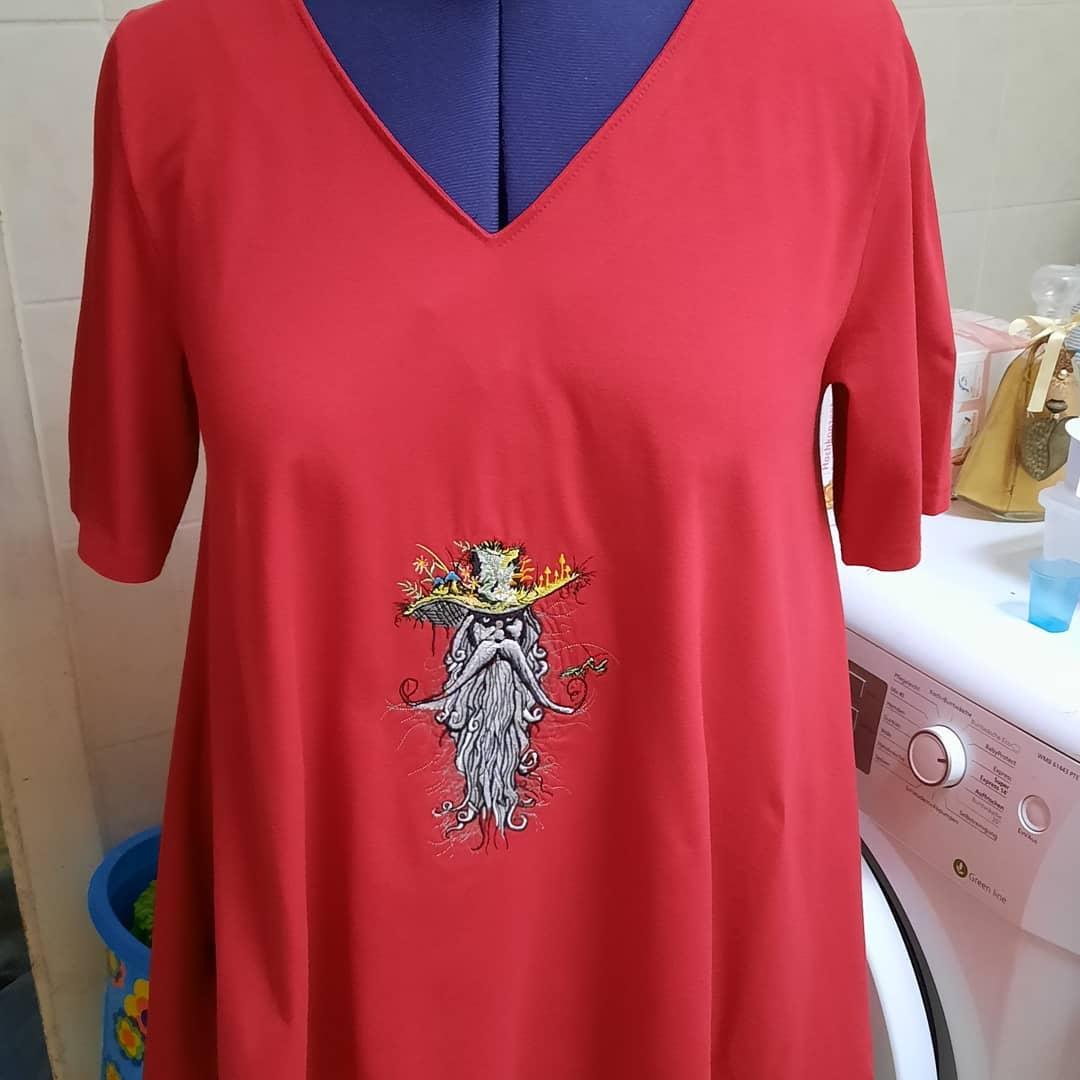 Blouse with embroidered root man design