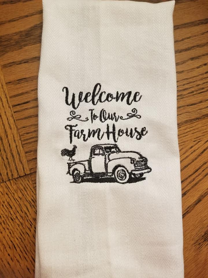 Embroidered towel with welcome to our farm house design