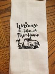 Embroidered towel with welcome to our farm house design