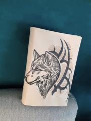 Embroidered_book_cover_with_tribal_wolf_design.jpg