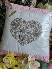 Embroidered cushion with heart design