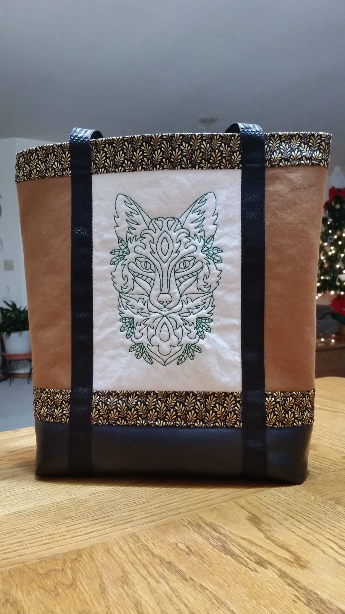 Bag with tribal wolf muzzle free embroidery design