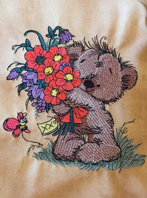 Embroidered teddy bear with flowers design