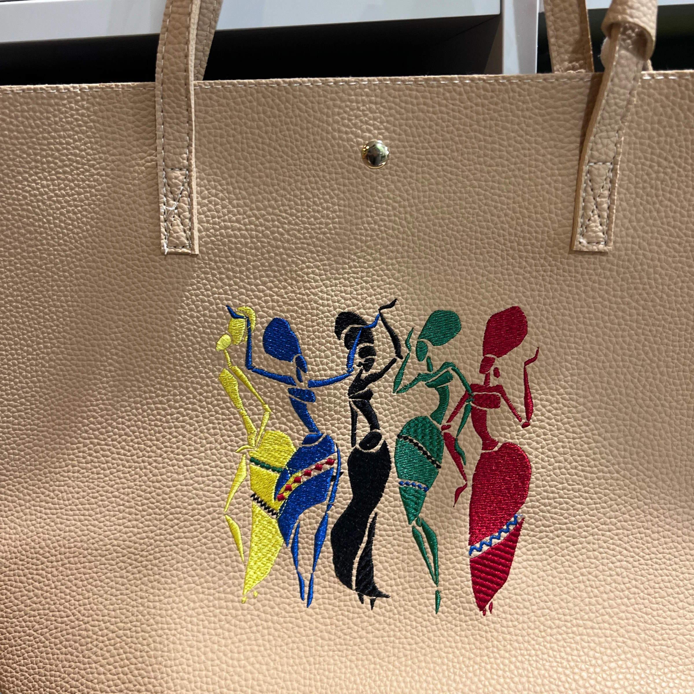 Dancing Woman Embroidery Design on a Leather Bag | Elevate Your Style