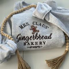 Cozy Elegance: Personalized Mrs. Claus Gingerbread Bakery Sweatshirt