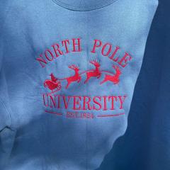 Crafting a DIY North Pole University Embroidery Designs for Hoodies!