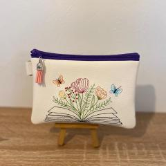 Floral Book Embroidery Design: Elevating Faux Leather Bags' Elegance