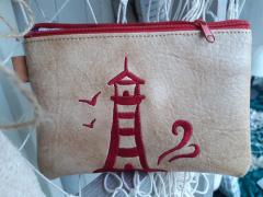 Lighthouse Embroidery Design: Unique Leather Bag Inspiration