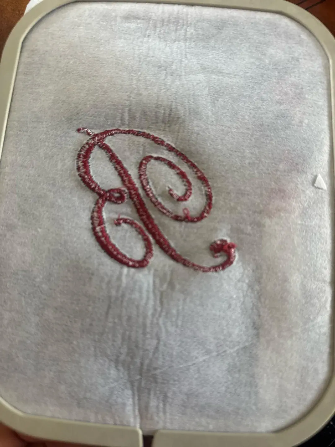 Finished B monogram on denim